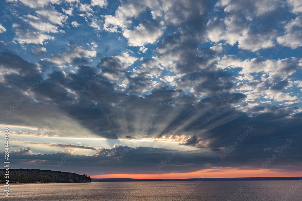Sunset and light rays over Lake Superior, Pictured Rocks National Lakeshore, Upper Peninsula, Michigan.