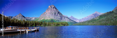 USA, Montana, Glacier NP. Tour boats cruise Upper Two Medicine Lake and deposit hikers near Mt. Sinopah in Glacier National Park, Montana.