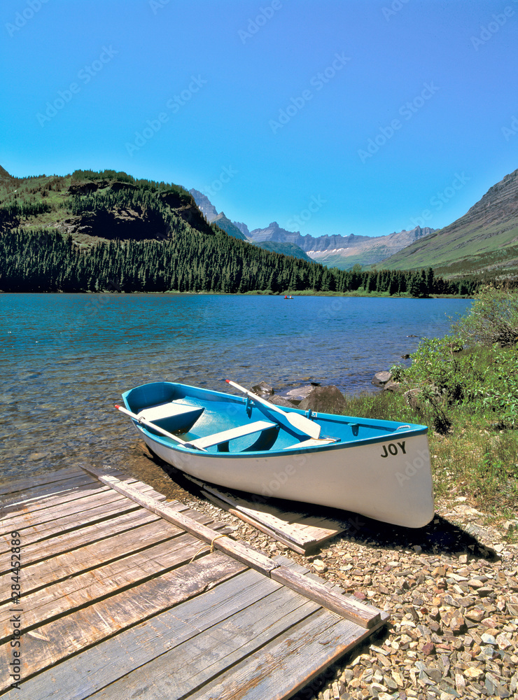 USA, Montana, Glacier NP. A canoe awaits its next adventurers at Swiftcurrent Lake, Glacier NP, Montana.
