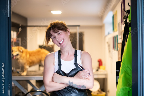portrait of professional pet hairdresser hipster woman