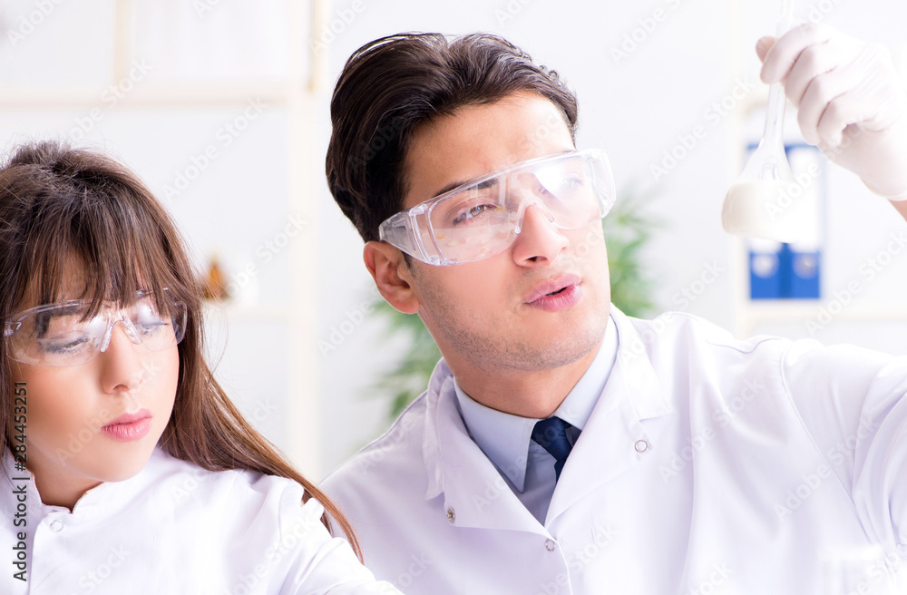Two lab doctor testing food products Two lab doctor testing food products