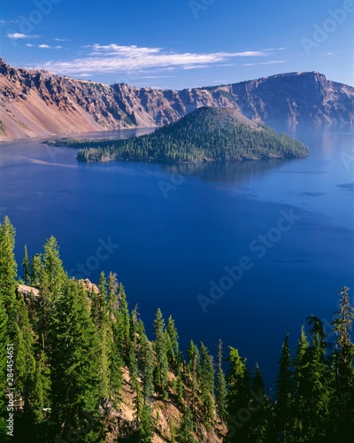 USA, Oregon, Crater Lake National Park. Crater Lake and Wizard Island with distant Llao Rock (right).