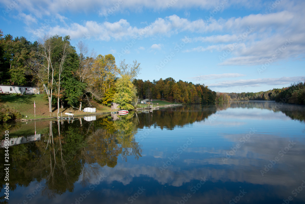 New York, Erie Canal. Early morning reflections on the Oswego Canal..