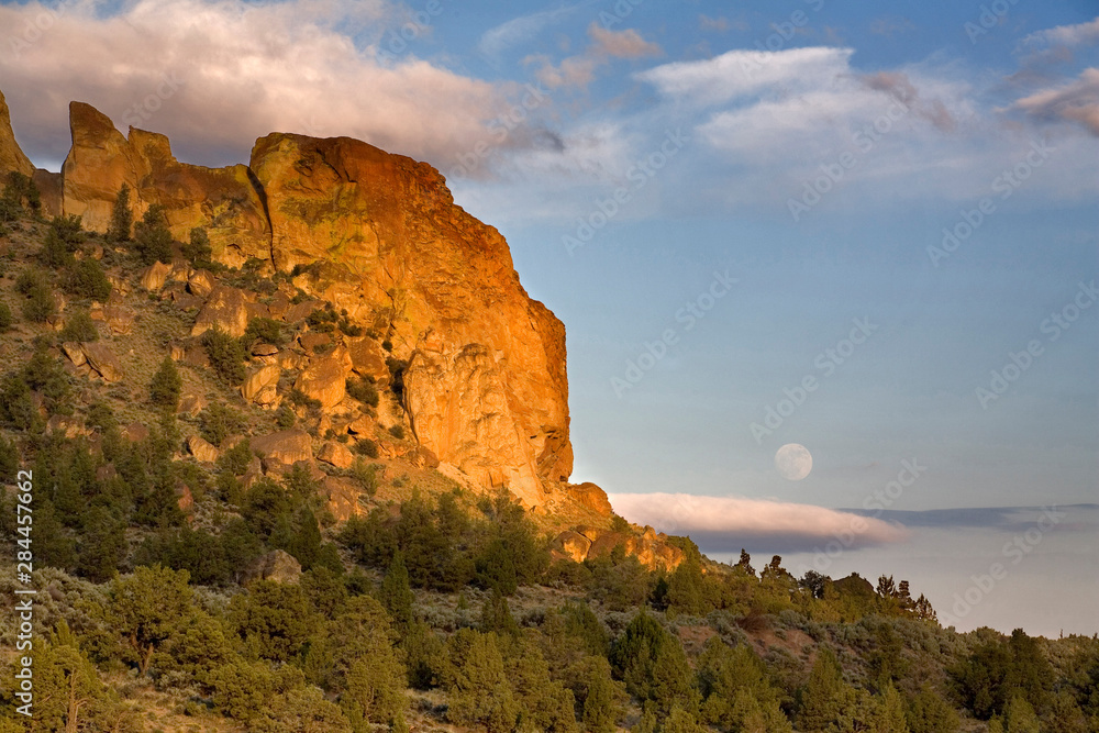 USA, Oregon, Smith Rocks SP. A full moon rises above the east side of Smith Rocks State Park in central Oregon.