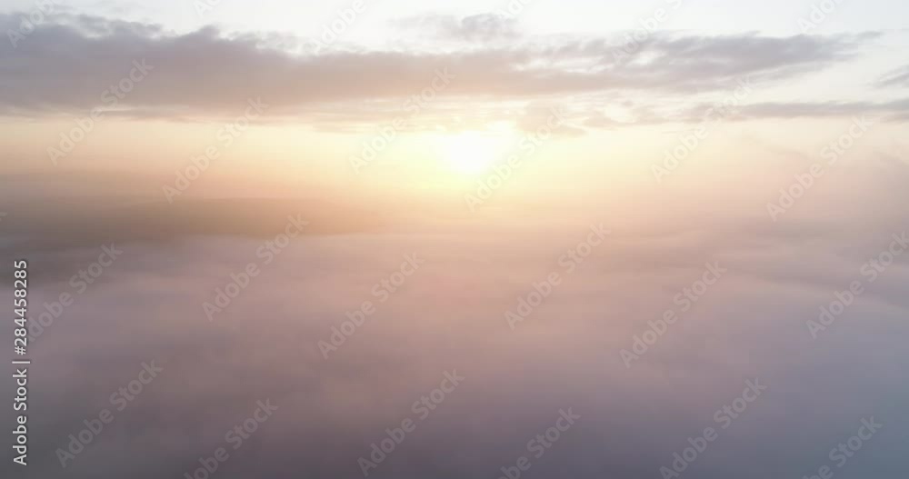 Flying above the clouds towards sunrise. Flying above the clouds towards sunrise.