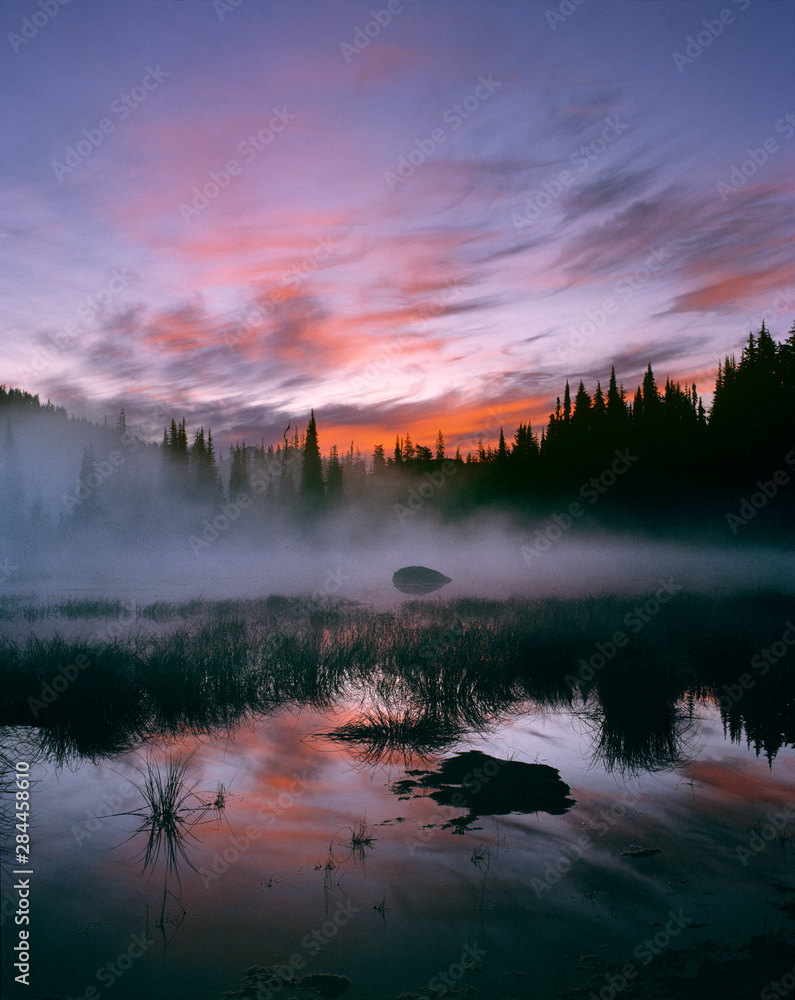 USA, Oregon, Sisters Mirror Lake. Colorful clouds fill the sunrise sky at Sisters Mirror Lake in Cascades Range, Oregon.