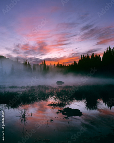 USA, Oregon, Sisters Mirror Lake. Colorful clouds fill the sunrise sky at Sisters Mirror Lake in Cascades Range, Oregon.