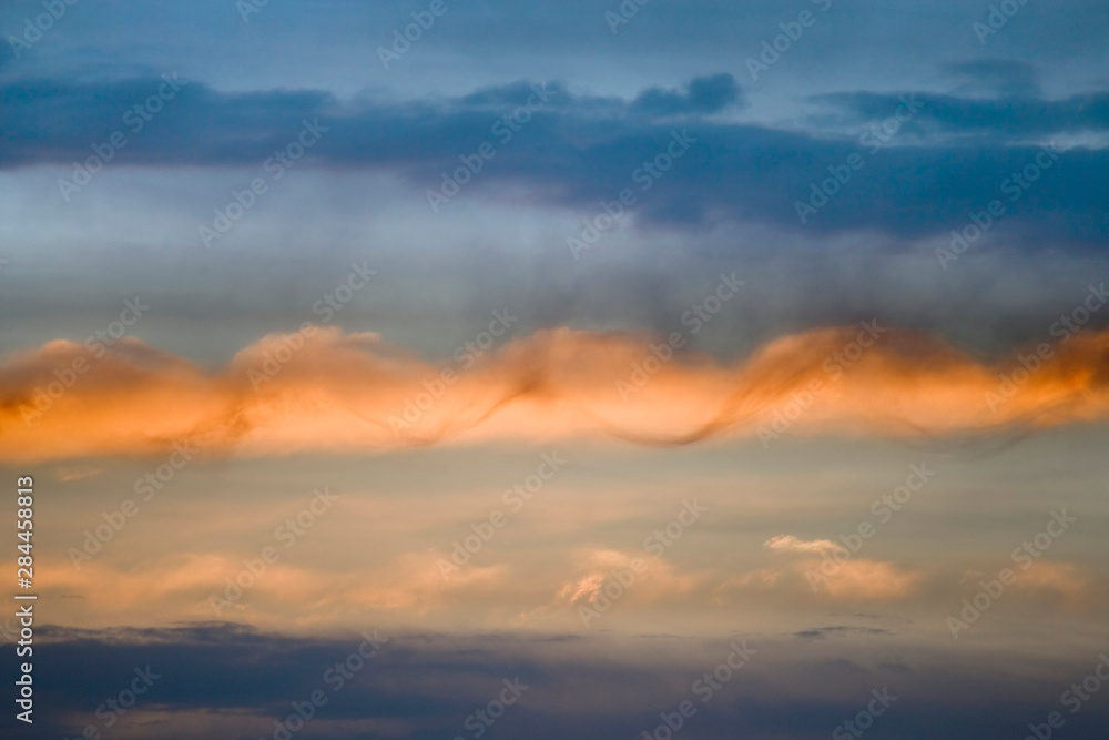 USA, Utah, Arches National Park. Sunset sky illumines spiral cloud. USA, Utah, Arches National Park. Sunset sky illumines spiral cloud.