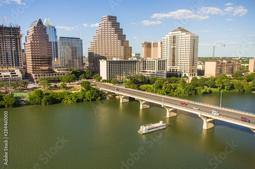 USA  Austin  Texas  Downtown Skyline with Cruise Boat on Lady Bird Lake  Colorado River crossing under the Bat Bridge.