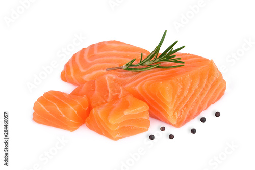 raw salmon piece with rosemary isolated on white background