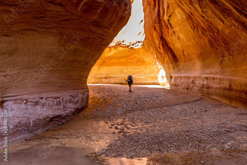 Hiking at Slide Arch in Paria Canyon, Vermillion Cliffs Wilderness, Southern Utah photo