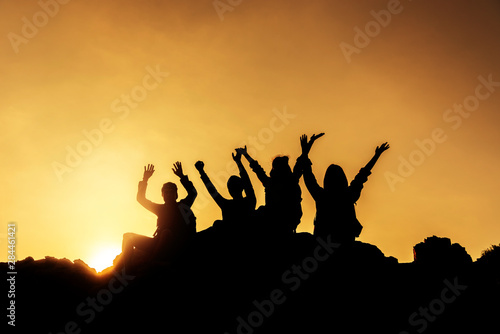 Group of asian female sitting on hill happily ..Group of asian female sitting on top mountain..