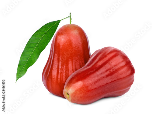 whole rose apple or chomphu with green leaf isolated on white background