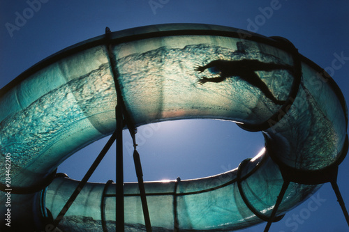 Fotografija USA, Utah, Logan, Kid in translucent waterslide