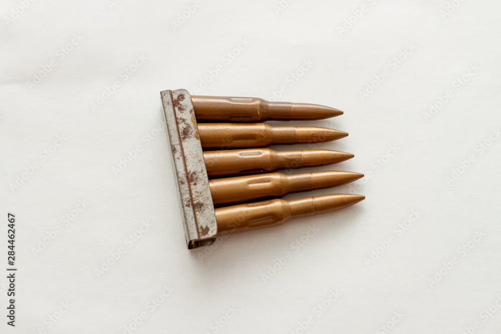 weapon cartridge for a firearm machine gun on white background weapon cartridge for a firearm machine gun on white background