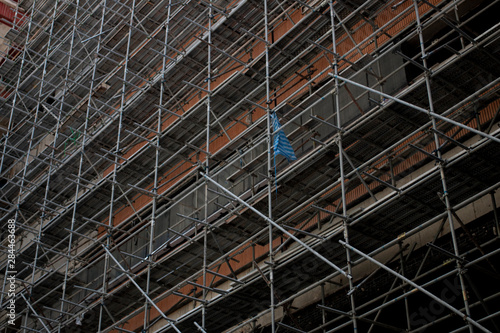 The scaffolding structure located in construction site.