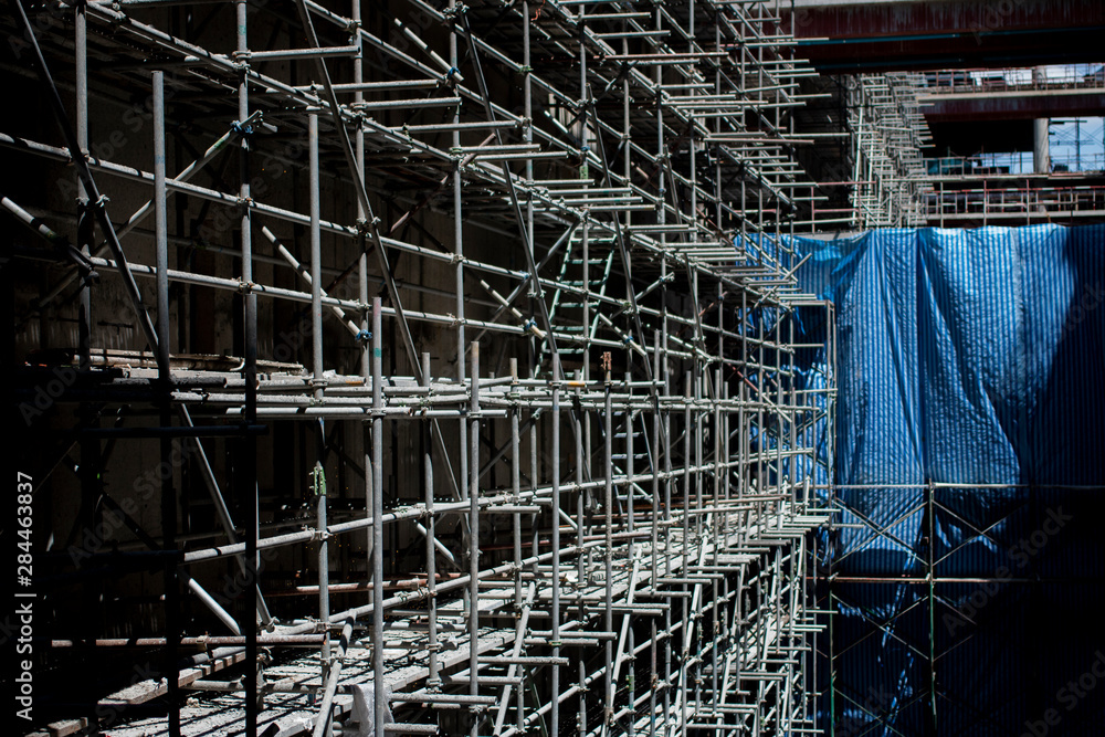 The scaffolding structure located in construction site.