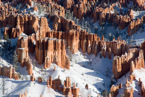 USA - Utah. Pillars of limestone at Bryce Canyon National Park after snowstorm at sunrise.
