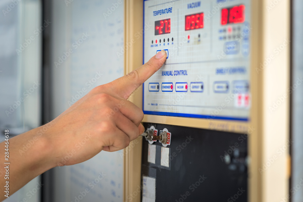 Man hand the controls of a modern machine Man hand the controls of a modern machine