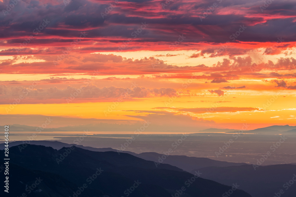 USA. Washington State. Layers of sunset clouds above north Puget Sound, a look at Bellingham to Vancouver, Canada from the Skyline Divide.