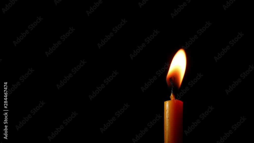 Candlelight in black background.Candle flame in dark room. Candlelight in black background.Candle flame in dark room.