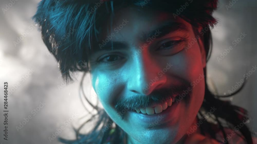 A man from the 70s 80s 90s with a mustache and a mullet hairstyle. Retro concept A man from the 70s 80s 90s with a mustache and a mullet hairstyle. Retro concept