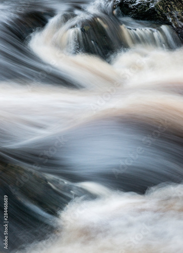 USA, Wisconsin. Abstract lines of water near crest of Big Manitou Falls, Pattison State Park.