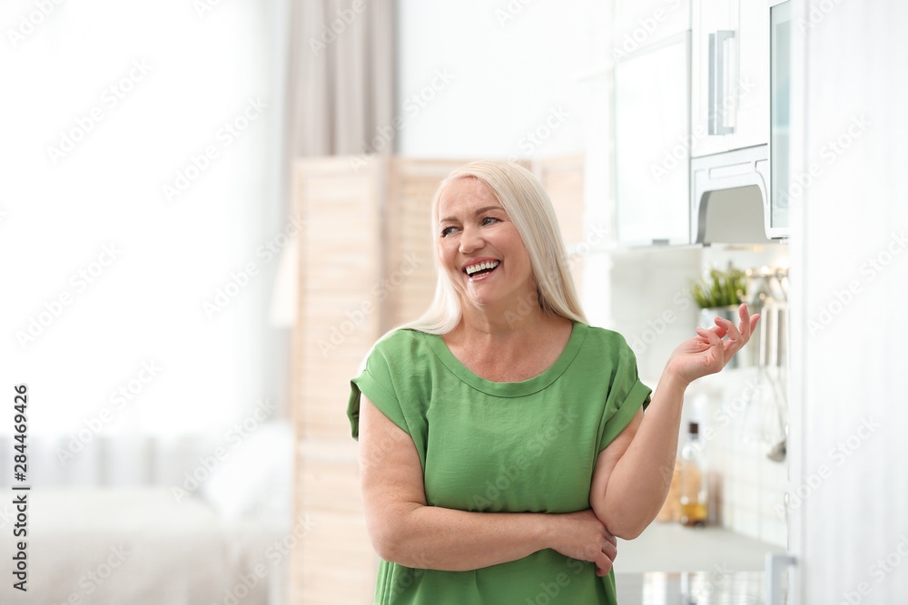 Portrait of happy mature woman at home Portrait of happy mature woman at home