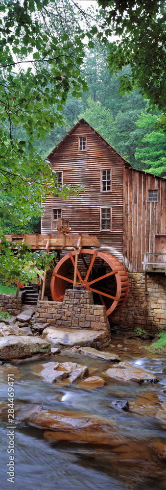 USA, West Virginia, Babcock SP. The vertical format enhances the aging structures of Glade Creek Grist Mill, in West Virginia's Babcock State Park USA, West Virginia, Babcock SP. The vertical format enhances the aging structures of Glade Creek Grist Mill, in West Virginia's Babcock State Park