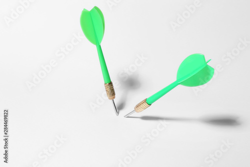 Green dart arrows for game on white background © New Africa