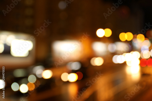 Blurred view of night city street with bokeh effect