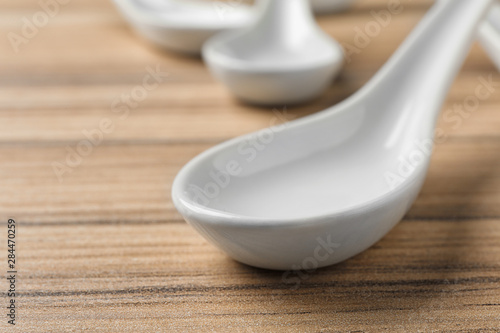 Fototapeta Naklejka Na Ścianę i Meble -  Miso soup spoon on wooden table, closeup