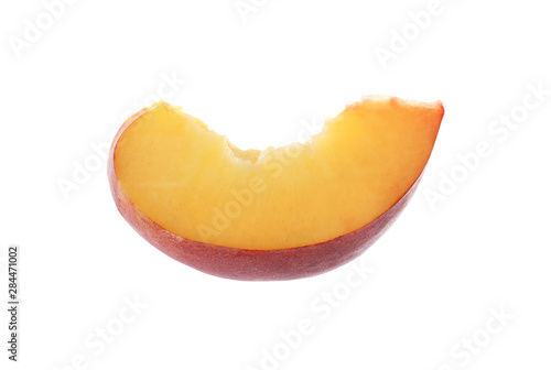 Slice of sweet juicy peach on white background
