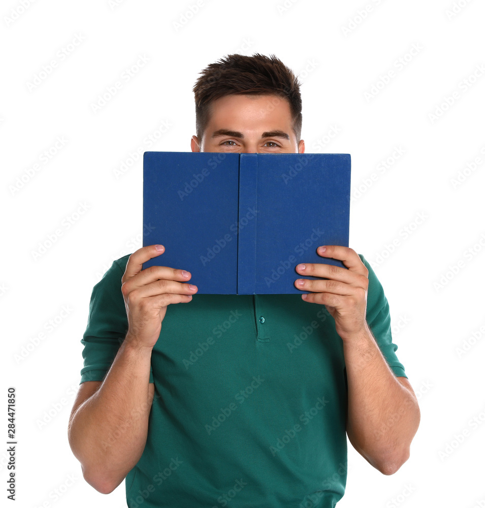 Handsome young man reading book on white background Handsome young man reading book on white background