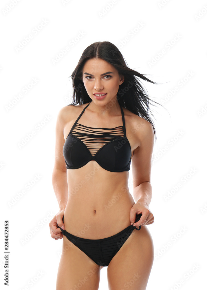 Beautiful young woman in black bikini on white background Beautiful young woman in black bikini on white background