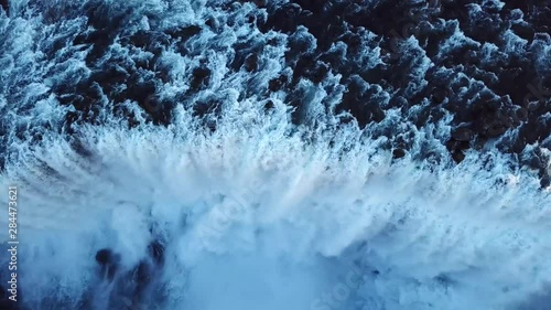 Aerial, top down, drone shot, descending above the strongest waterfall in Europe, the Dettifoss fall, at Jokulsa a Fjollum river, in the Jokulsargljufur national park, on a sunny day, in North Iceland photo