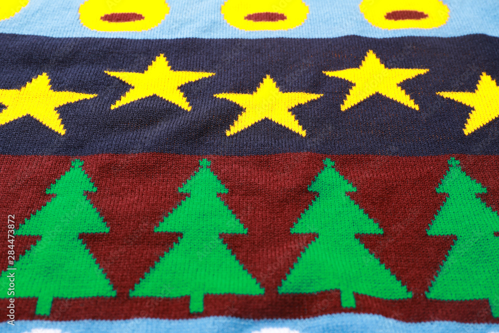 Warm Christmas sweater as background, closeup view Warm Christmas sweater as background, closeup view
