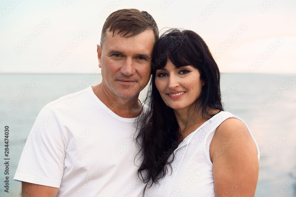 Happy mature couple spending time together on sea beach Happy mature couple spending time together on sea beach