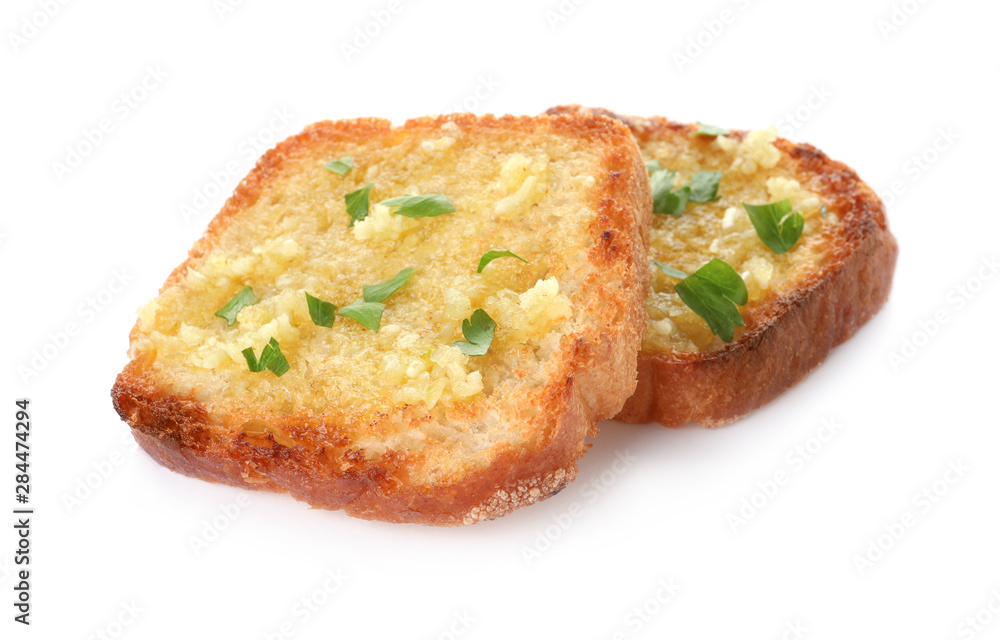 Slices of toasted bread with garlic and herb on white background Slices of toasted bread with garlic and herb on white background