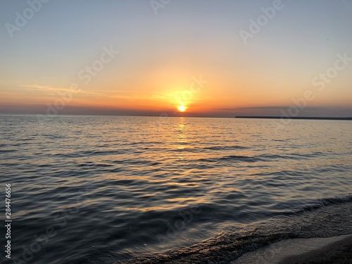 Beautiful sunset on the calm sea © Vlada