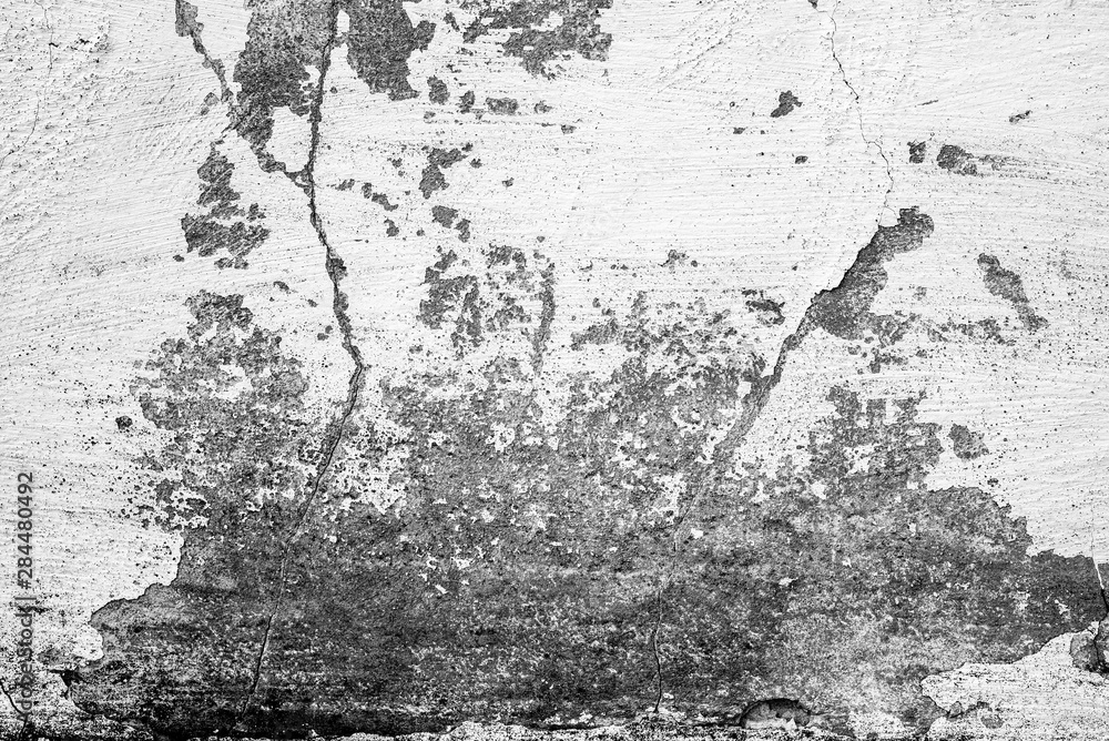 Obraz premium Texture of a concrete wall with cracks and scratches which can be used as a background