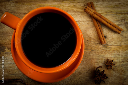 Cup of drink on a wooden background. View from above.