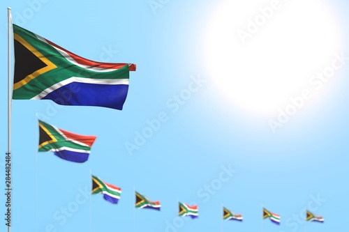 nice many South Africa flags placed diagonal with bokeh and empty place for content - any holiday flag 3d illustration..