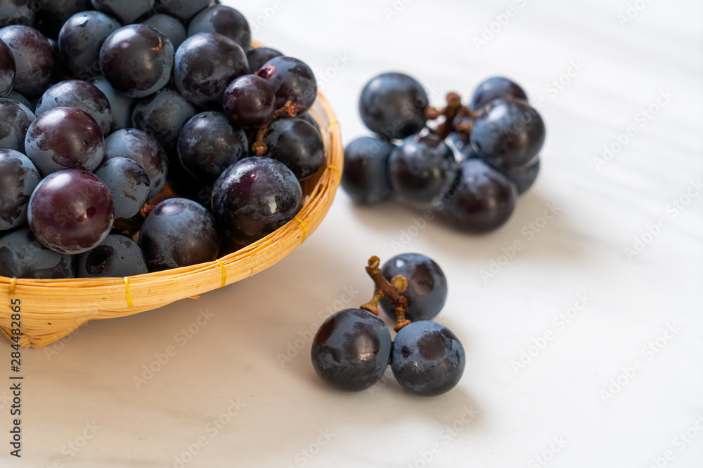 fresh black grapes on white background fresh black grapes on white background