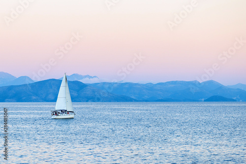 Beautiful bay with sailing boat yacht. Sailboat in a mediterranean sea. Yachting, travel, active lifestyle, summer fun and enjoying life concept