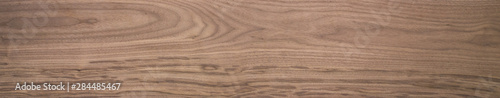 Black walnut wood texture of solid board untreated