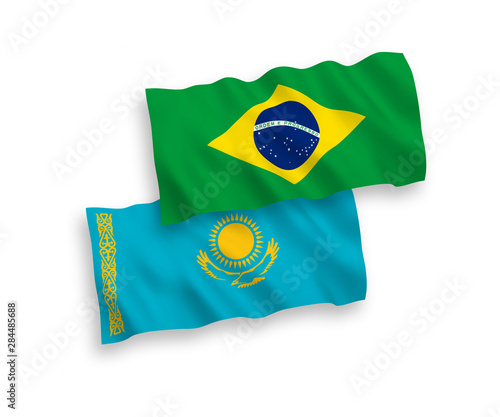 National vector fabric wave flags of Kazakhstan and Brazil isolated on white background. 1 to 2 proportion.