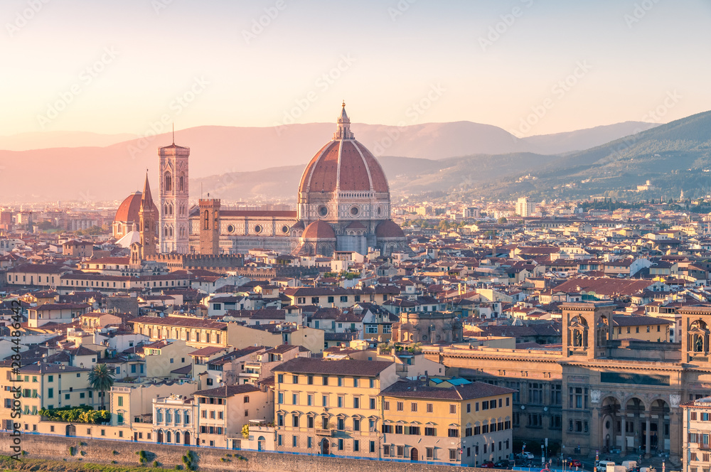 Cathedral of Santa Maria del Fiore and Florence rooftops with mountains