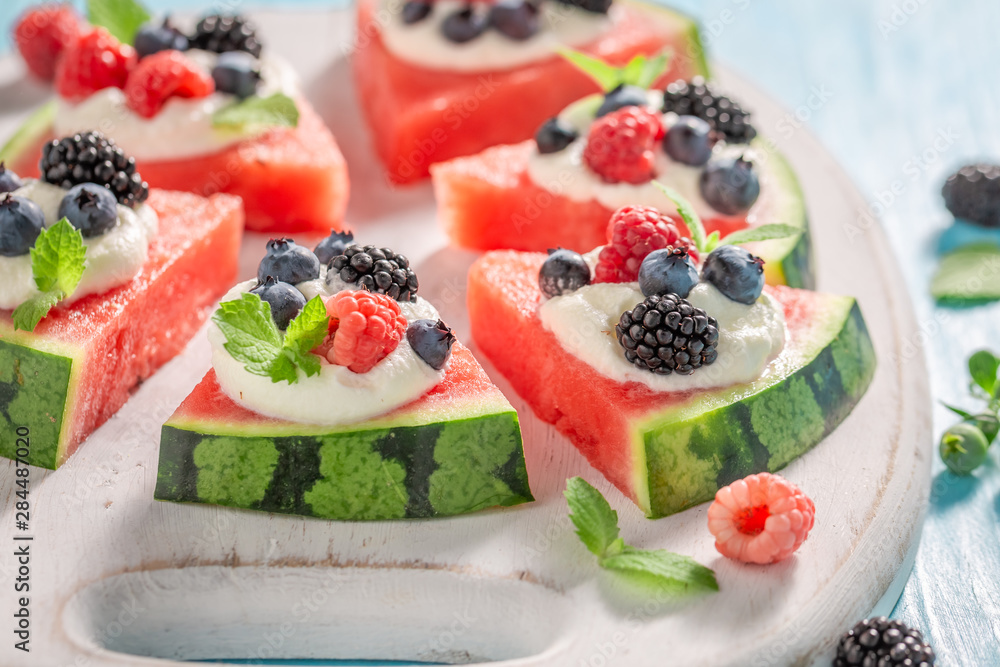 Closeup of watermelon pizza with blueberries, raspberries and cream Closeup of watermelon pizza with blueberries, raspberries and cream