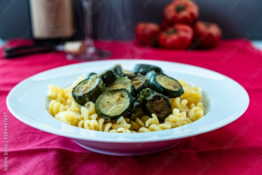 Italian food: pasta with zucchini and parmesan Italian food: pasta with zucchini and parmesan